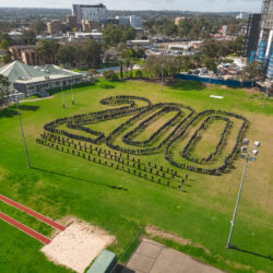 School team formation photo by drone, forming the number 200 to celebrate their 200th aniversary. Photo taken by Sky Monkey